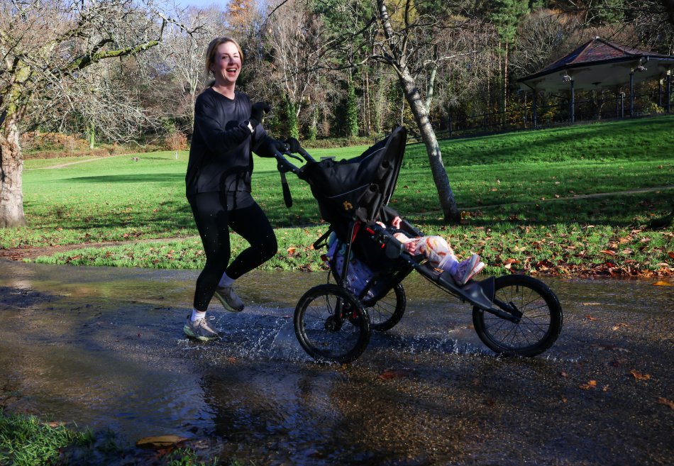 Nicola running with her child in the pram